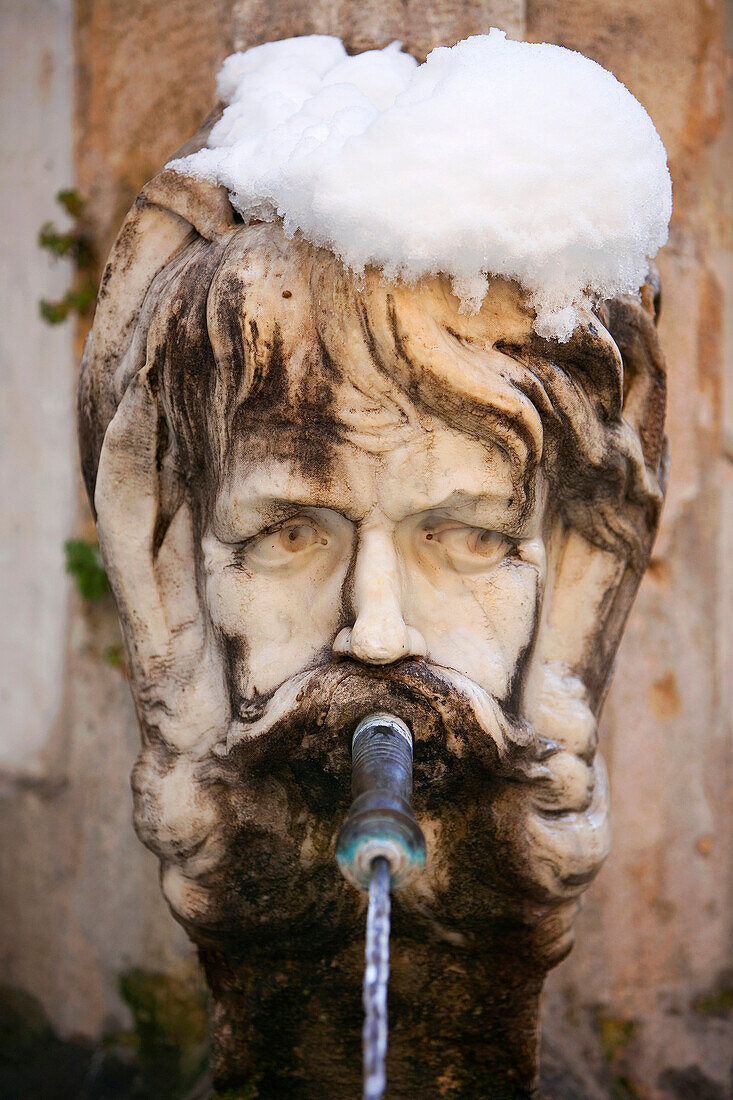 France, Bouches du Rhone, Aix en Provence, close up of the fountain of the town hall under snow in winter