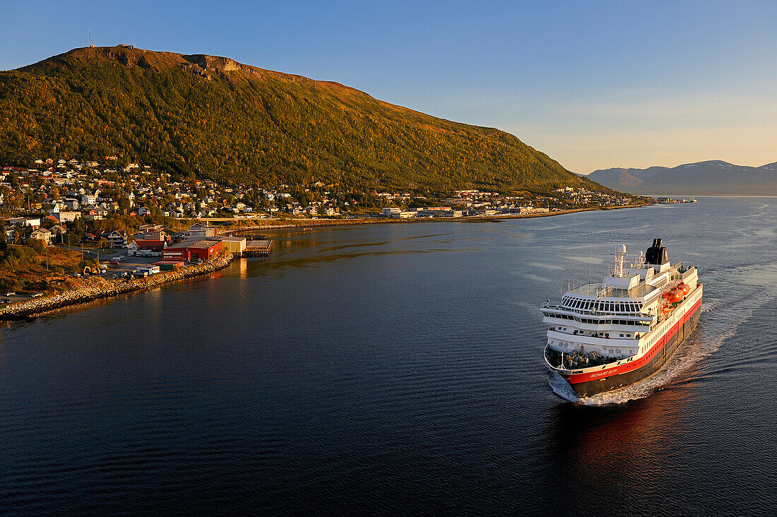 Norway, Troms County, Tromso harbour, the Coastal Express (Hurtigruten) in Tromsesundet Fjord