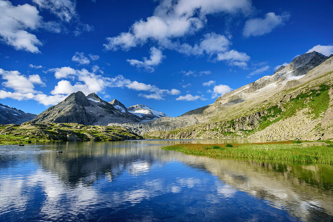 Mountain lake with Lobbia Alta and Corno di Bedola, hut rifugio Madron, Adamello-Presanella Group, Trentino, Italy