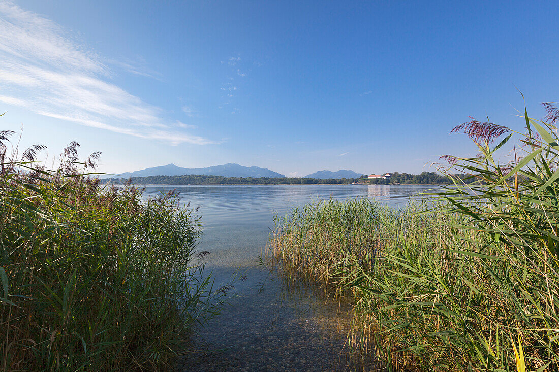 View over Chiemsee to the old castle at Herreninsel, near Gstadt, Bavaria, Germany