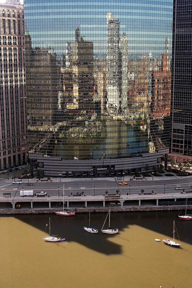 United States, Illinois, Chicago, the Loop District, reflection on a tower of West Wacker Drive in front of the Chicago River