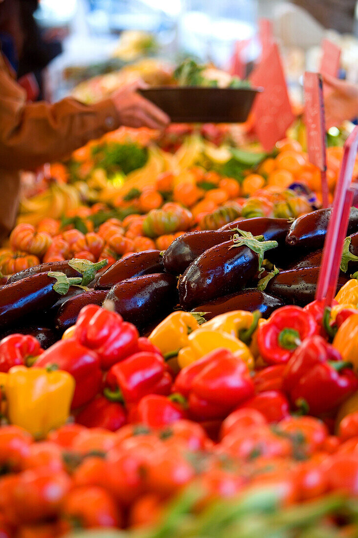 France, Alpes Maritimes, Menton, market in front of the municipal covered market, red peppers and eggplants