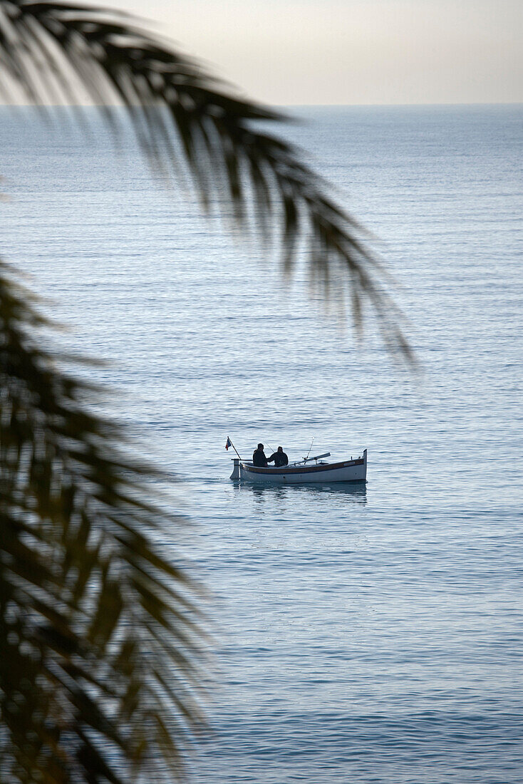 France, Alpes Maritimes, Nice, fisherman's pointu boat (traditional Mediterranean boats) in front of the Promenade des Anglais seen from Negresco Hotel