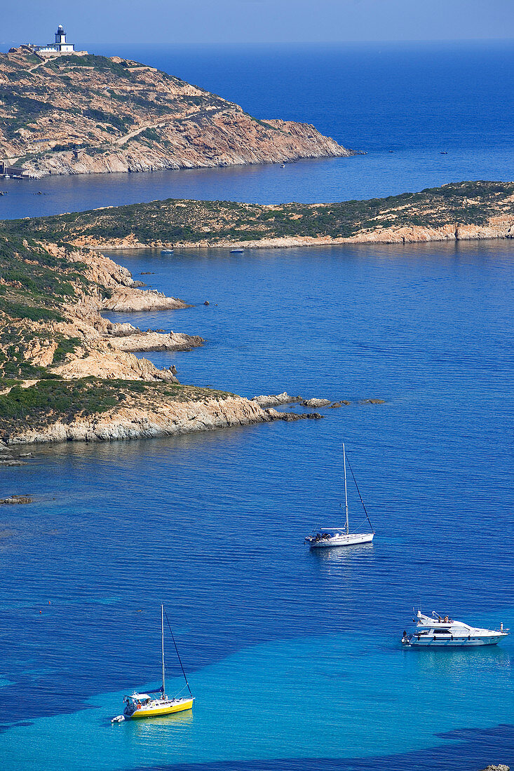 France, Haute Corse, Calvi, Pointe de la Revellata, with La Revellata lighthouse, Golfe de la Revellata, boats anchorage