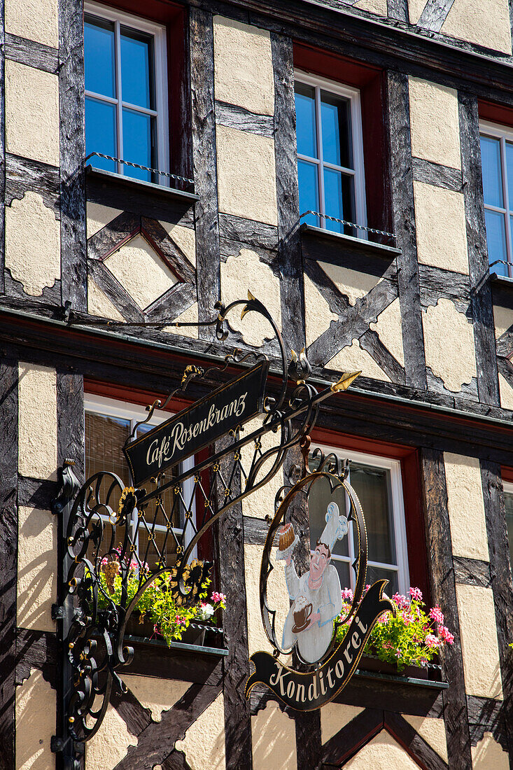 Sign of Konditorei Cafe Rosenkranz bakery on half-timbered building in Altstadt old town, Lohr am Main, Spessart-Mainland, Bavaria, Germany