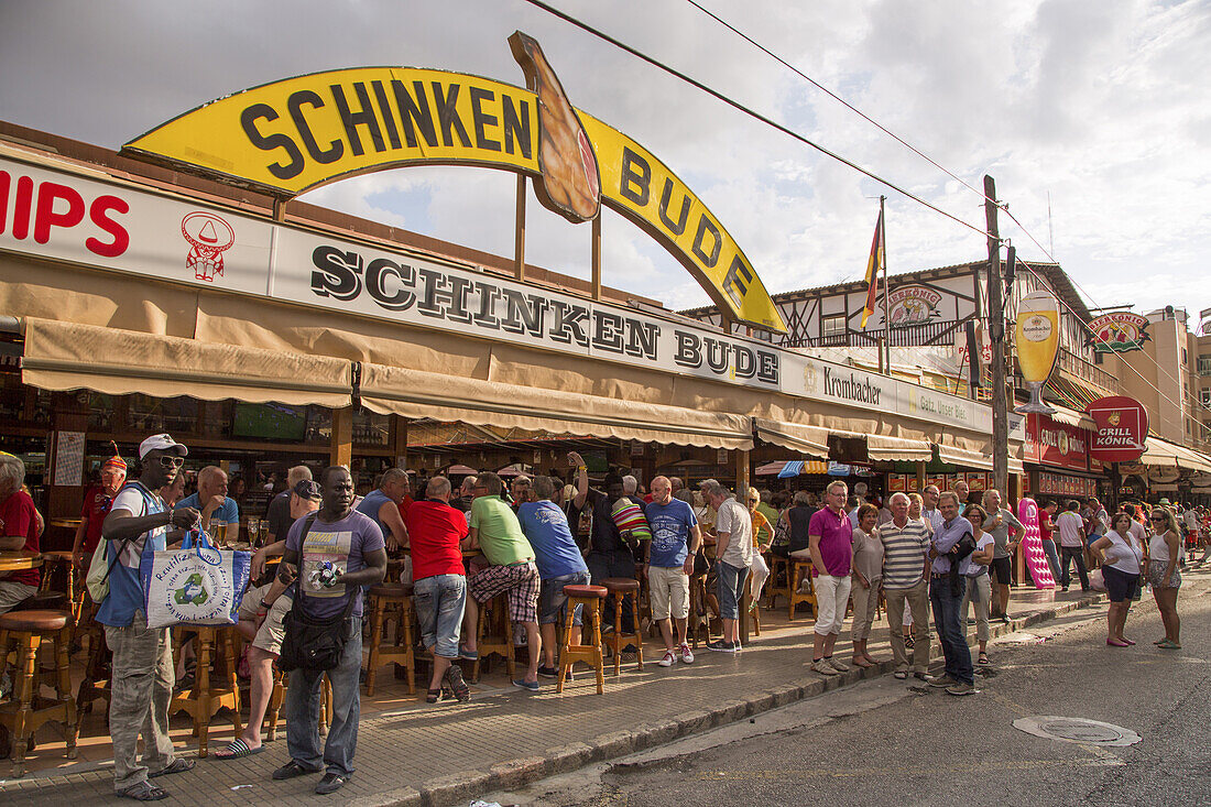 People drink and party at Schinkenbude near Bierkönig bar and beer hall, s'Arenal, near Palma, Mallorca, Balearic Islands, Spain