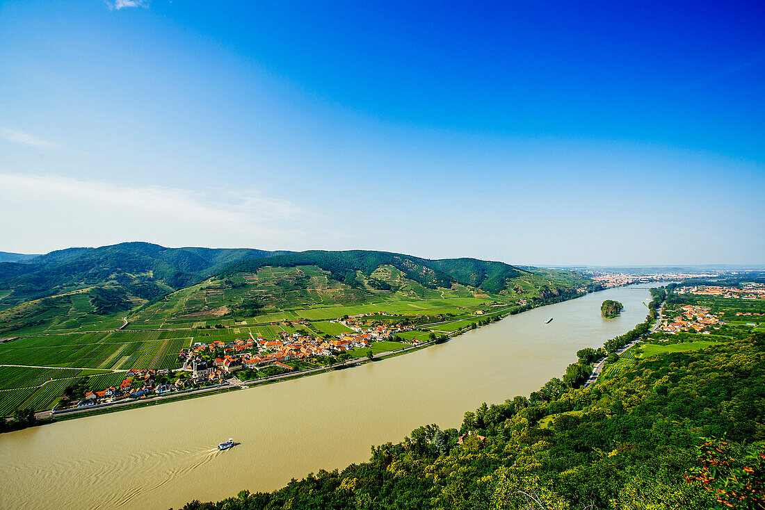 Boats on river near village