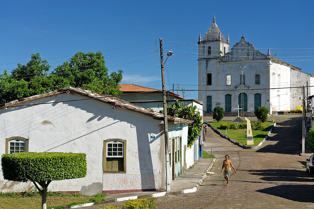 Brazil, Bahia State, Cairu Island, main street in the village of Cairu and its church