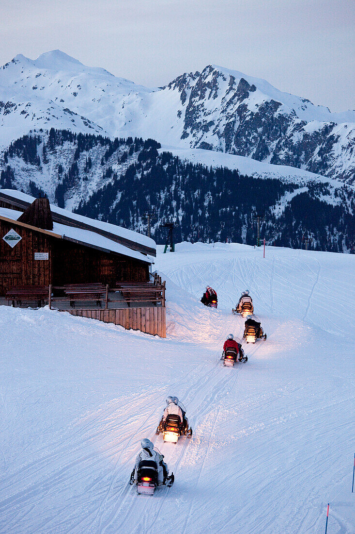 France, Savoie, Tarentaise, Massif de la Vanoise, Valmorel, riding scooter at the top of Les Lanchettes by night