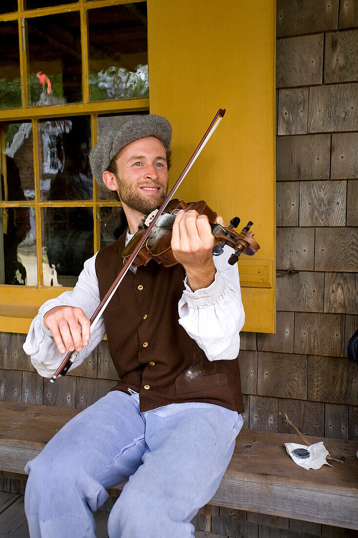 Canada, New Brunswick, the Acadian coast, the Acadian historic village of Caraquet, violin player