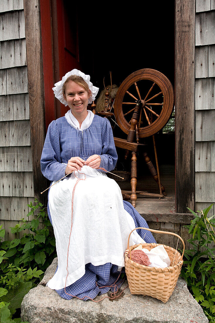 Canada, New Brunswick, Prince William, Kings Landing, living history village reenacting loyalist village from the beginning of the 19th century, young lady and her knit