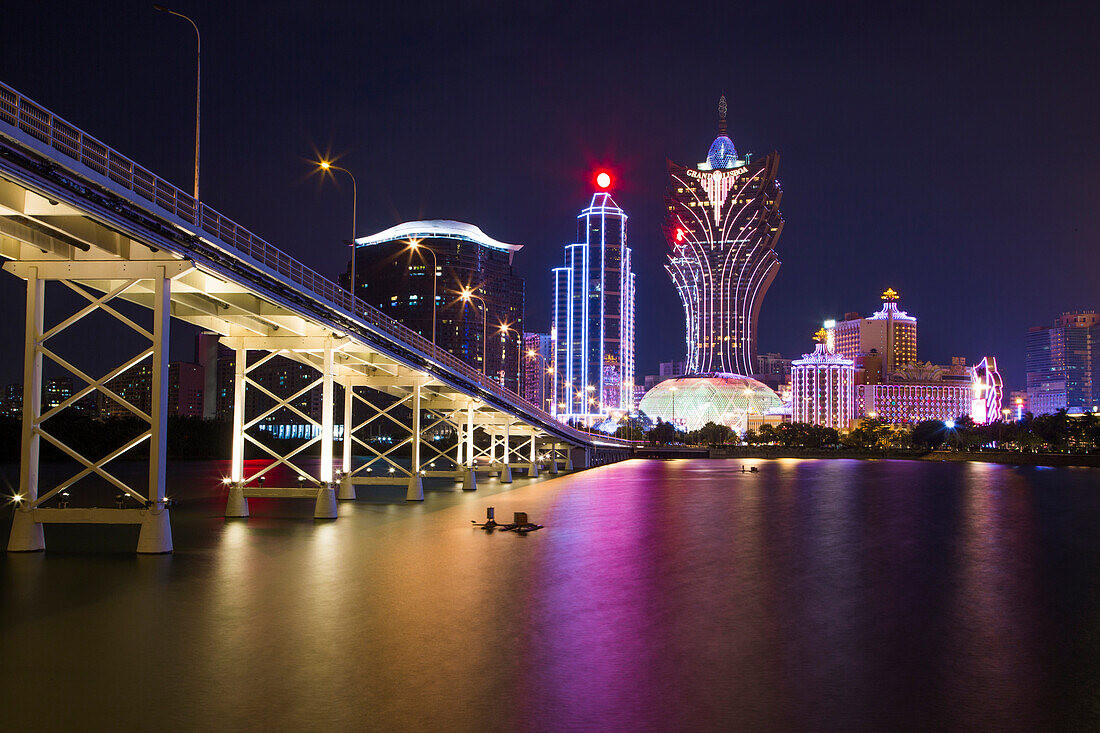 Illuminated city skyline with Grand Lisboa Hotel & Casino at night, Macau, Macau, China