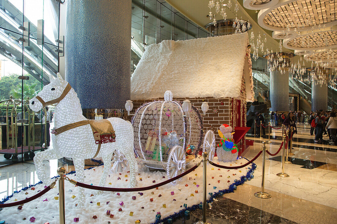 Christmas decorations and giant gingerbread house on display in lobby of Grand Lisboa Hotel & Casino, Macau, Macau, China