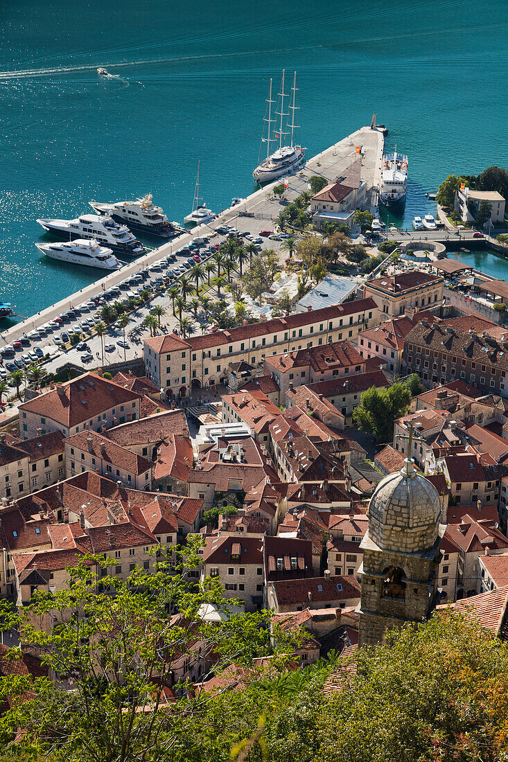 Overhead of Kotor Old Town with motor sailing cruise ship M/S Panorama (Variety Cruises) at pier, Kotor, Montenegro