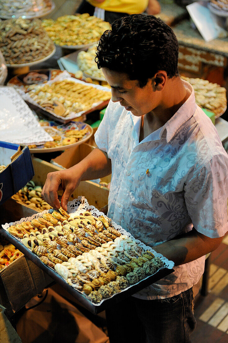 Morocco, Meknes Tafilalet Region, Meknes, Imperial City, medina listed as World Heritage by UNESCO, El Hedime covered market, stalls with pastries