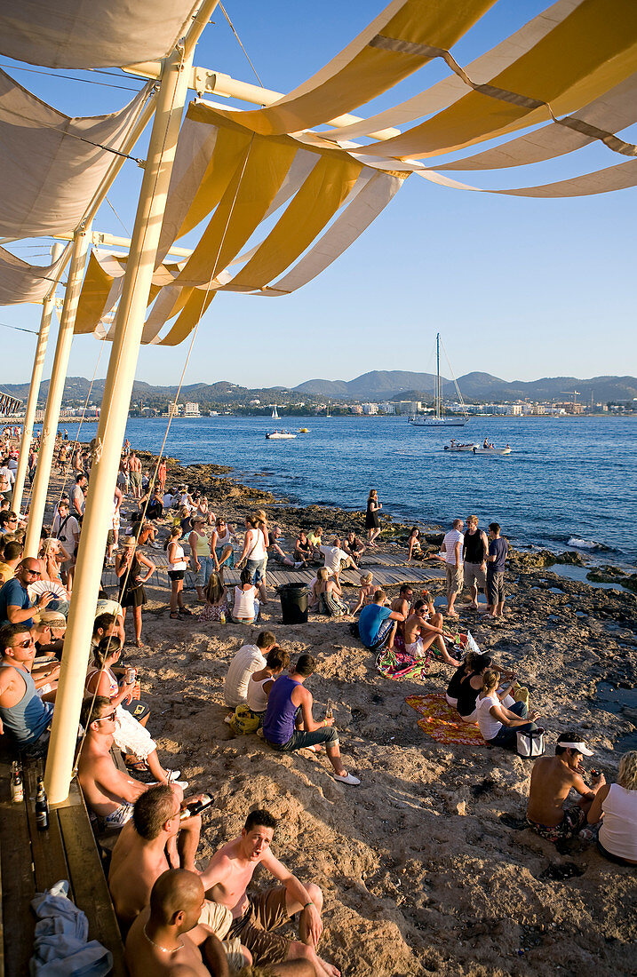 Spain, Balearic Islands, Ibiza island, Sant Antoni, every day at sunset, young people meet at the Cafe del Mar