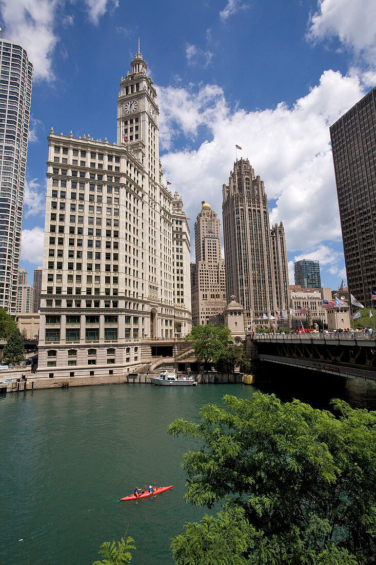 United States, Illinois, Chicago, kayak on Chicago River and Wrigley Building in the background