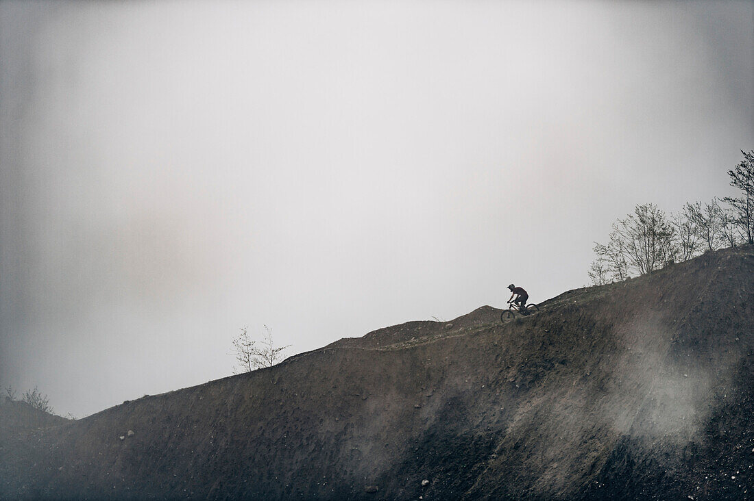 Mountainbiker within the misty mountains, Brandnertal, Vorarlberg, Austria, Alps, Mountains, Downhill
