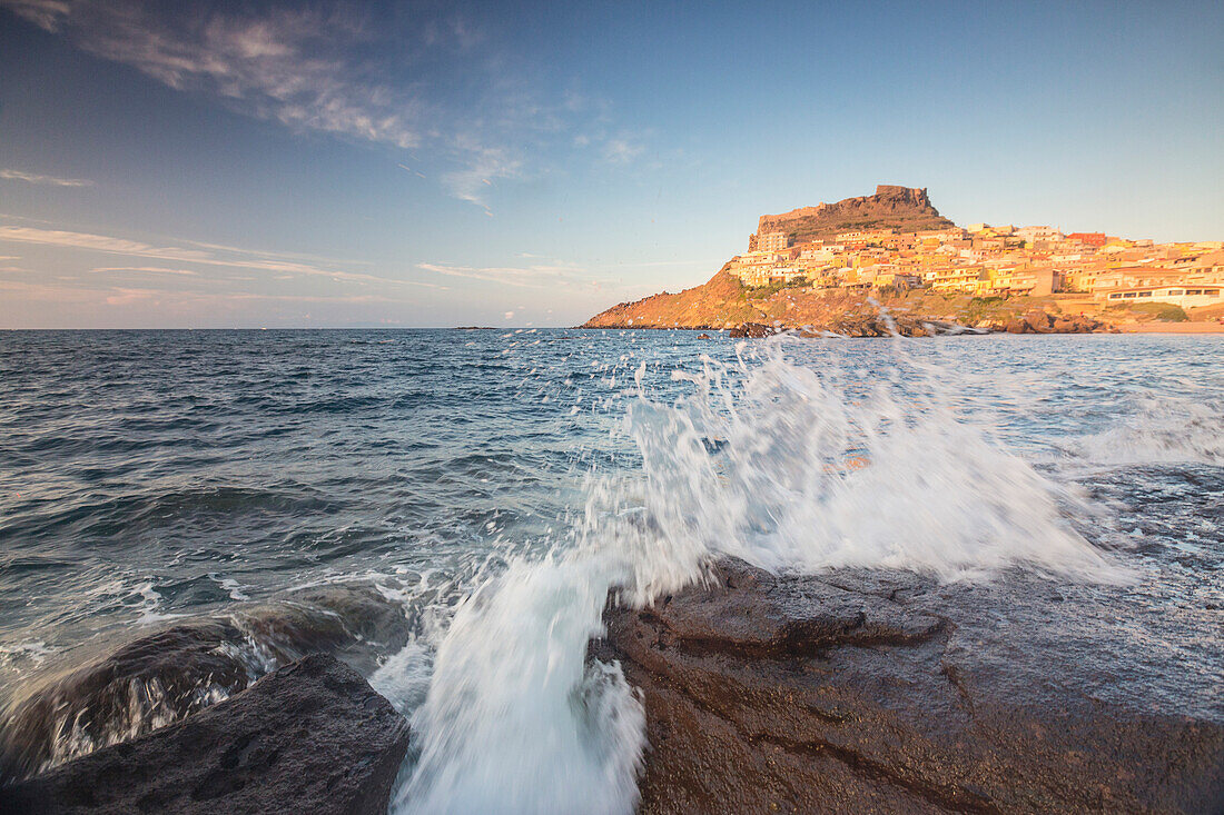 Waves of blue sea frame the village perched on promontory, Castelsardo, Gulf of Asinara, Province of Sassari, Sardinia, Italy, Mediterranean, Europe