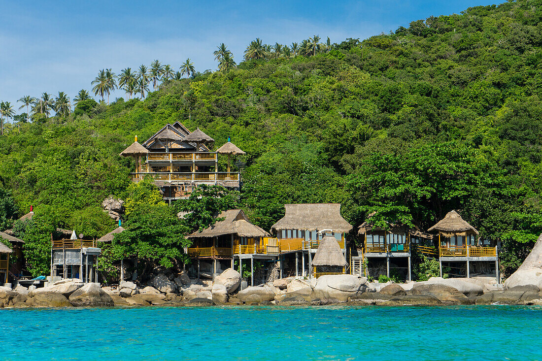 A traditional Thai resort overlooks turquoise water on the tropical island of Koh Tao, Thailand, Southeast Asia, Asia