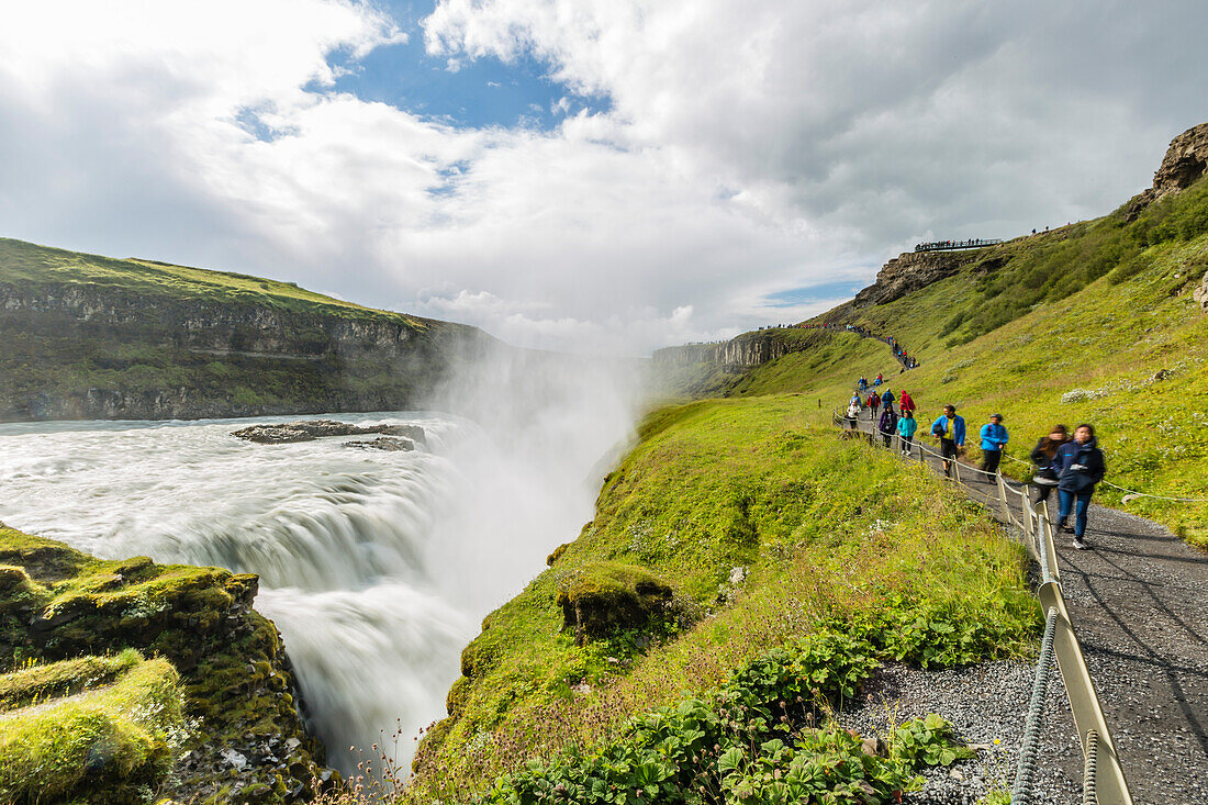Tourists visiting Gullfoss (Golden Falls), a waterfall located in the canyon of the Hvita River in southwest Iceland, Polar Regions