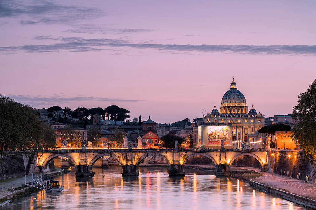 Dusk lights on Tiber River with bridge Umberto I and Basilica di San Pietro in the background, Rome, Lazio, Italy, Europe