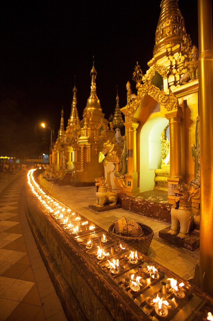 Oil lamps, Shwedagon Pagoda, Yangon (Rangoon), Myanmar (Burma), Asia