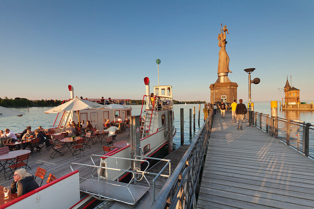 Statue of Imperia by Peter Lenk at the seaport, restaurant on a ship, Konstanz, Lake Constance, Baden-Wurttemberg, Germany, Europe