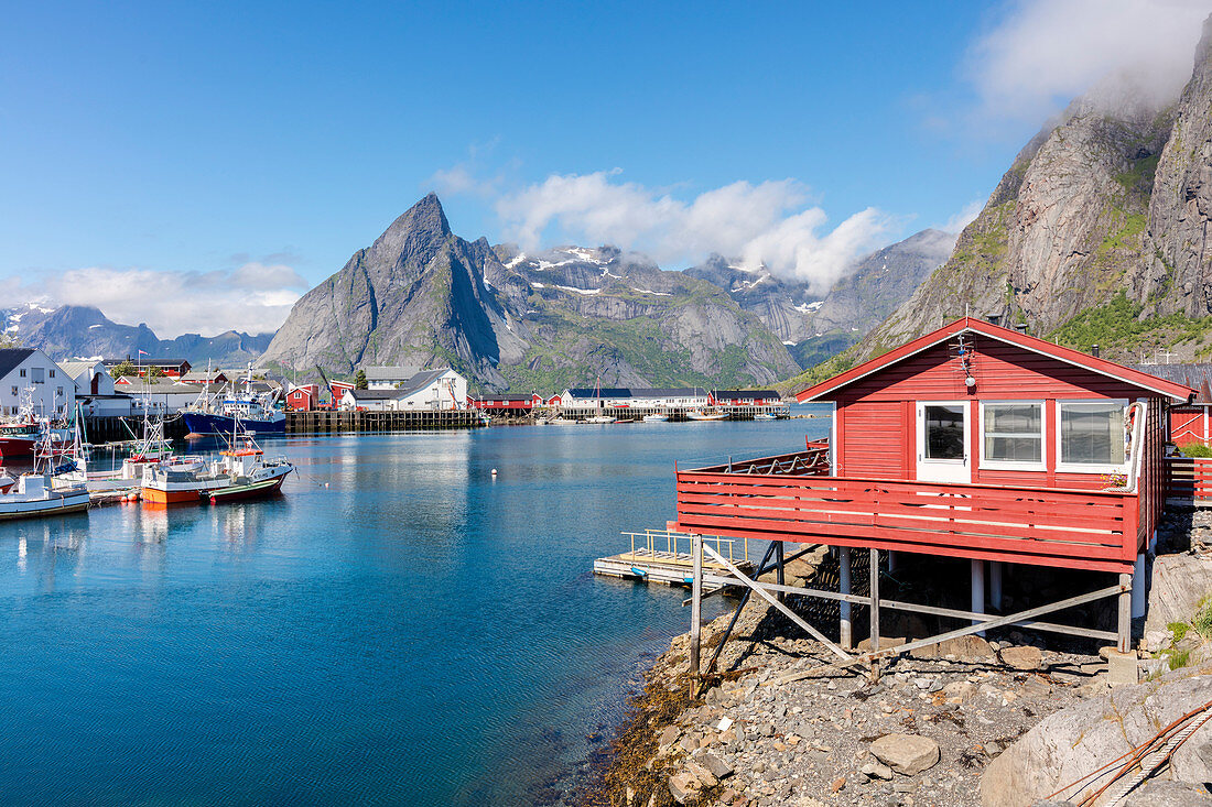 Fishing village and harbour framed by peaks and sea, Hamnoy, Moskenes, Nordland county, Lofoten Islands, Arctic, Northern Norway, Scandinavia, Europe