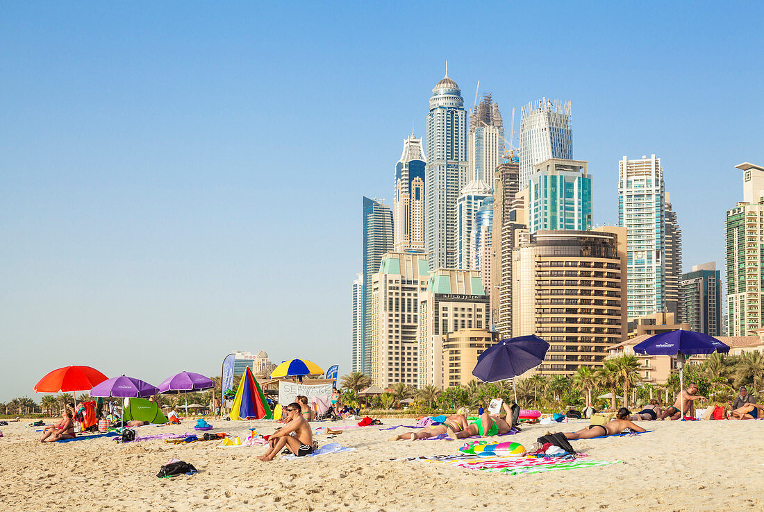 Sunbathers on the Public Dubai Beach at JBR (Jumeirah Beach Resort), Dubai, United Arab Emirates, Middle East