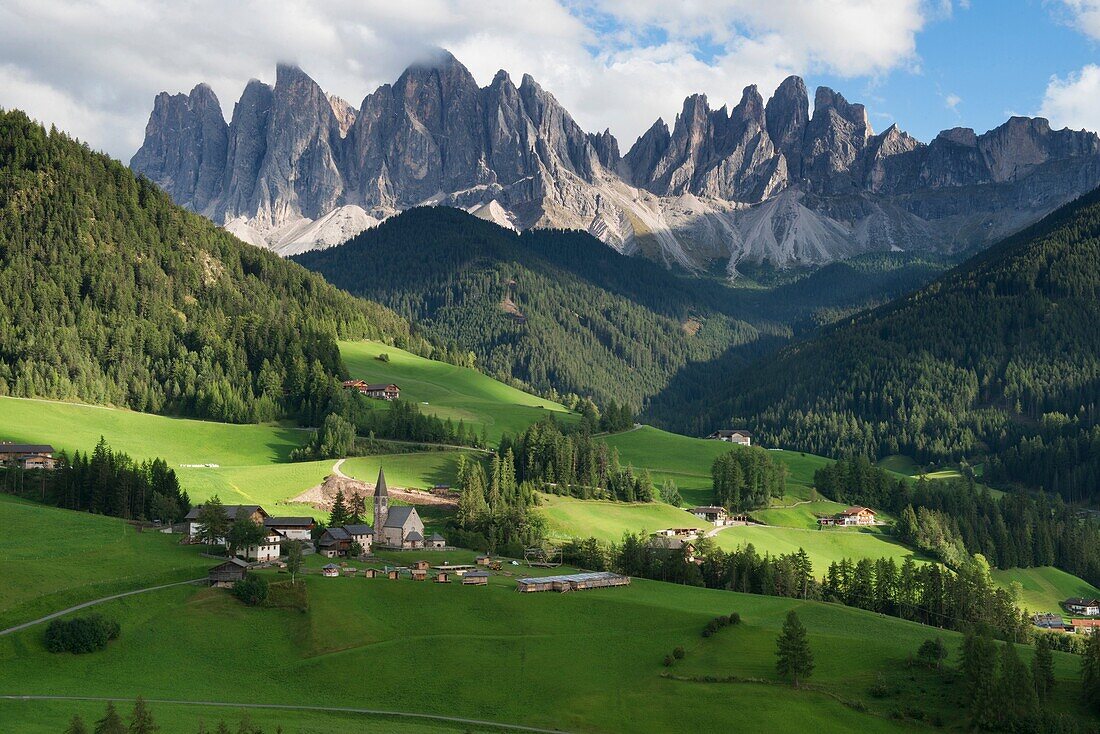 The beautiful Santa Maddalena and Val di Funes under the magnificent Odle Range in the Puez Odle Nature Park, Dolomites, South Tirol, Italy.