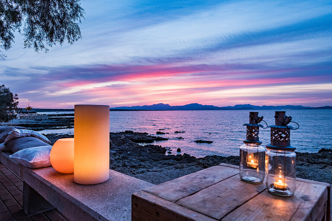 sunset over Alcudia bay, promenade at Colonia de Sant Pere, Mallorca, Balearic Islands, Spain