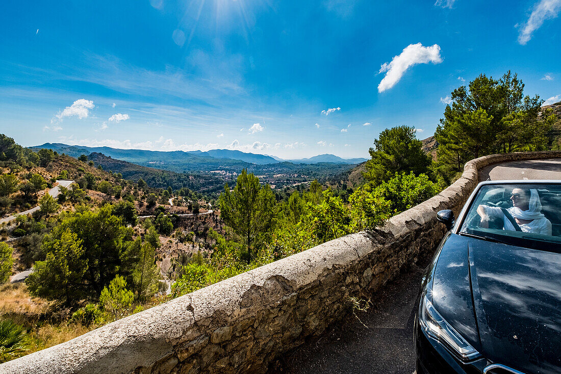 women with a convertible in the mountains near Arta, Mallorca, Balearic Islands, Spain