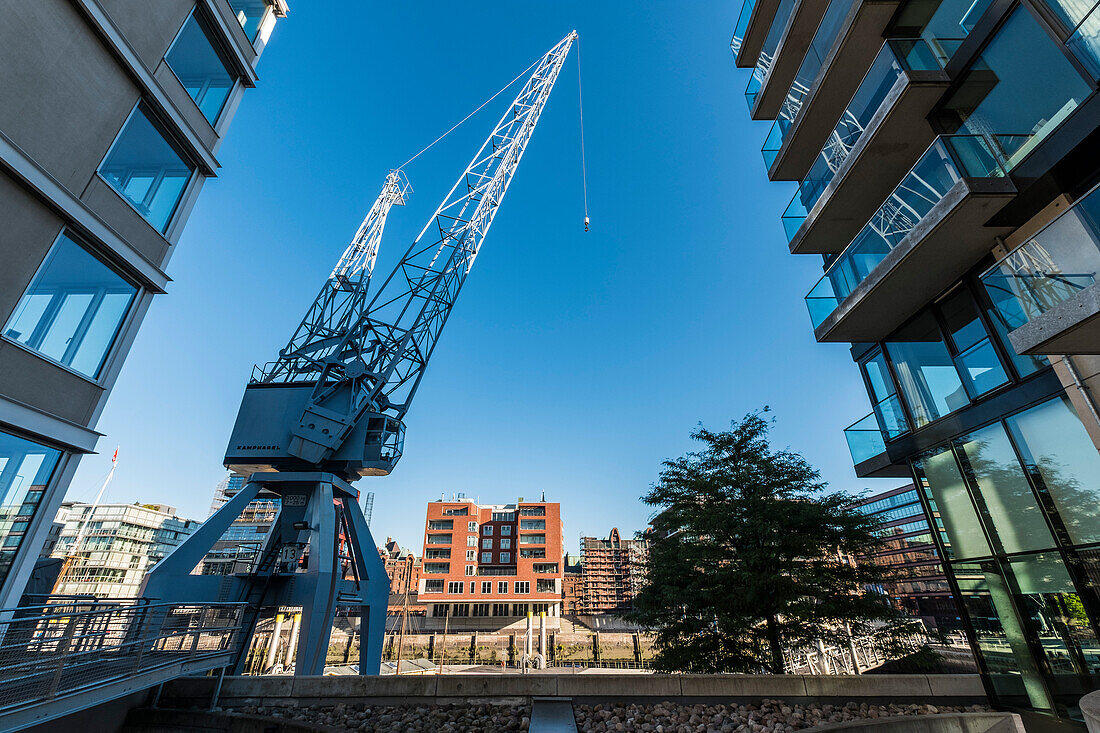 view through modern houses to the Sandtorkai in the hafencity of Hamburg, north Germany, Germany