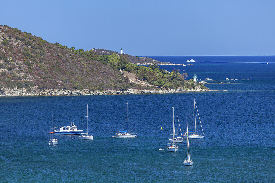 Sailboats near Saint-Florent, in the background the Desert of Agriates, Corsica, Southern France, France, Southern Europe