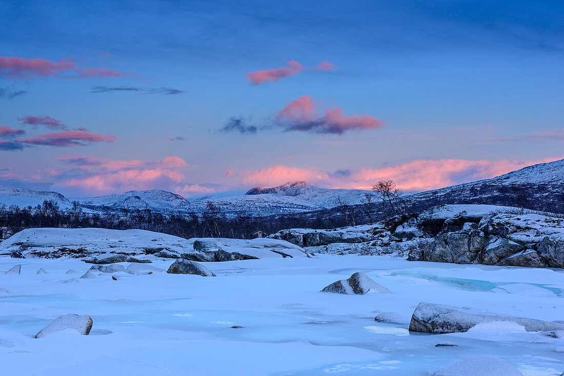 Ice-covered river with mountains in background, Saltfjell, Norland, Norway