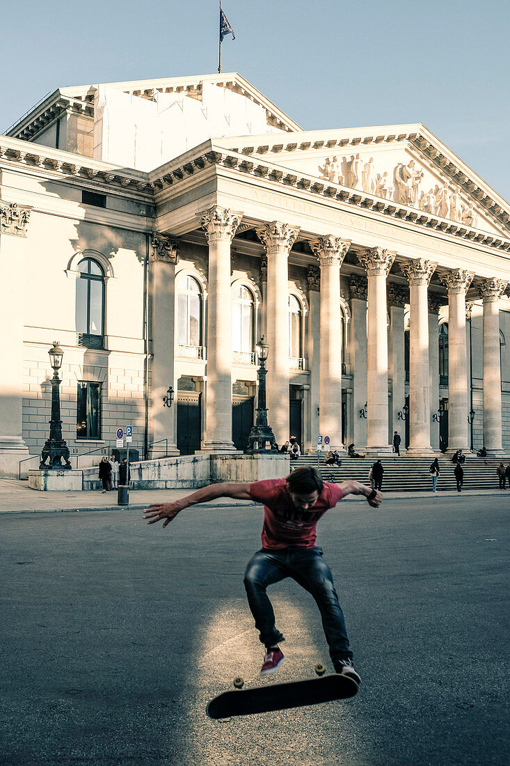 Skateboarder in front of the Residenz Theater in Munich, Bavaria, Germany