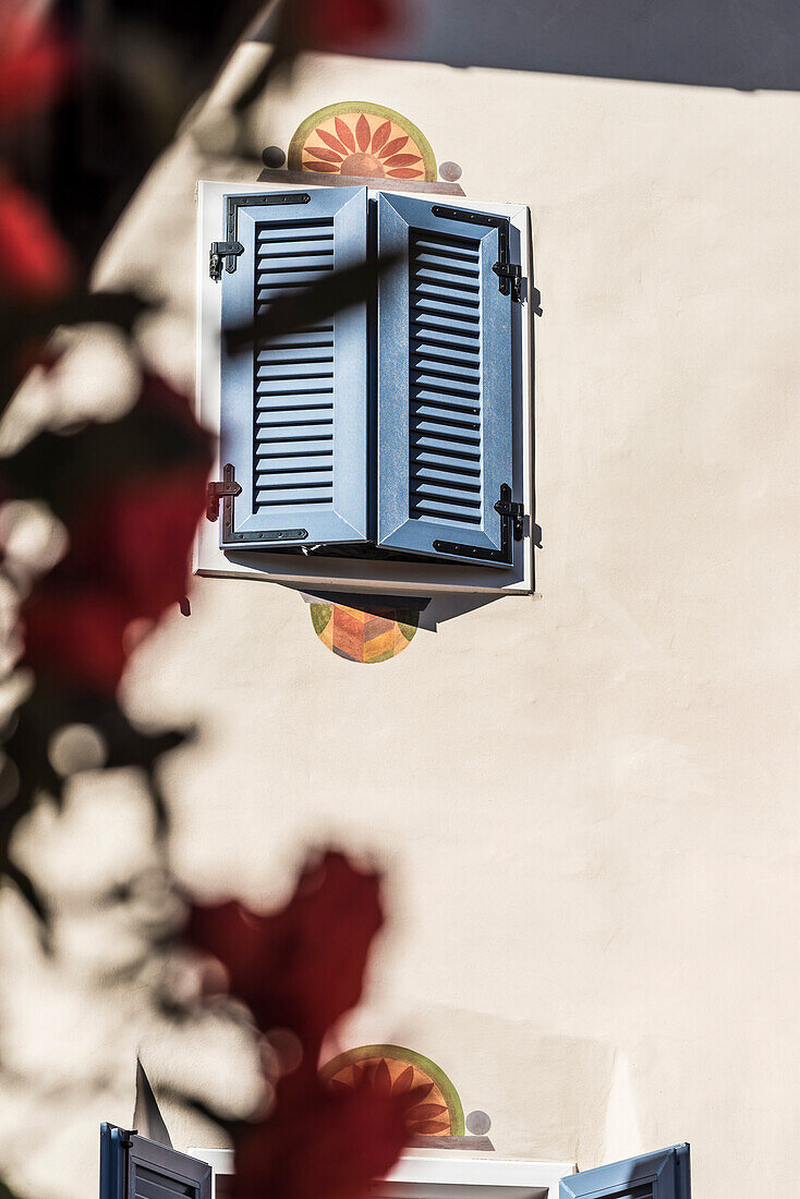 A typical house facade with shutter, Truden, South Tyrol, Italy