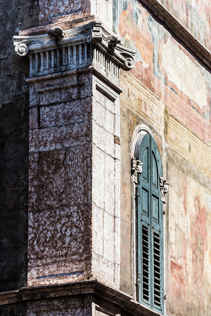 An old house with weather-beaten facade in the Old Town, Trento, Trentino, South Tyrol, Italy