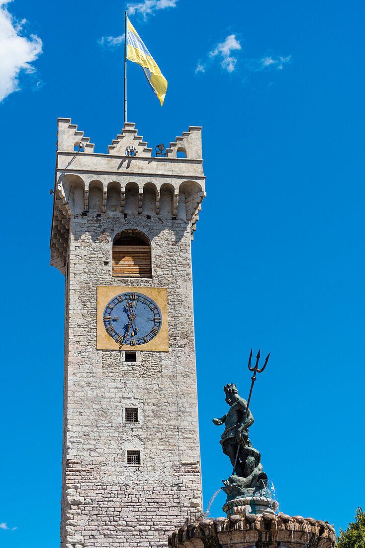 The attraction Torre Civica and Neptune's fountain on cathedral square, Trento, Trentino, South Tyrol, Italy