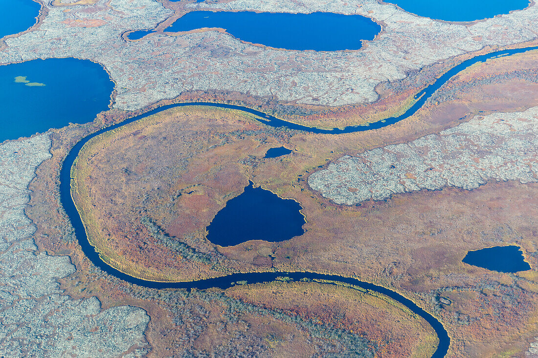 Aerial view of a stream that runs through a tundra landscape filled with small ponds, Yukon Delta, Arctic Alaska, Saint Mary's, Alaska, United States of America