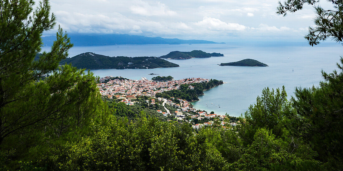 View of the Aegean Sea and a village on the coast of a greek island, Skiathos, Greece