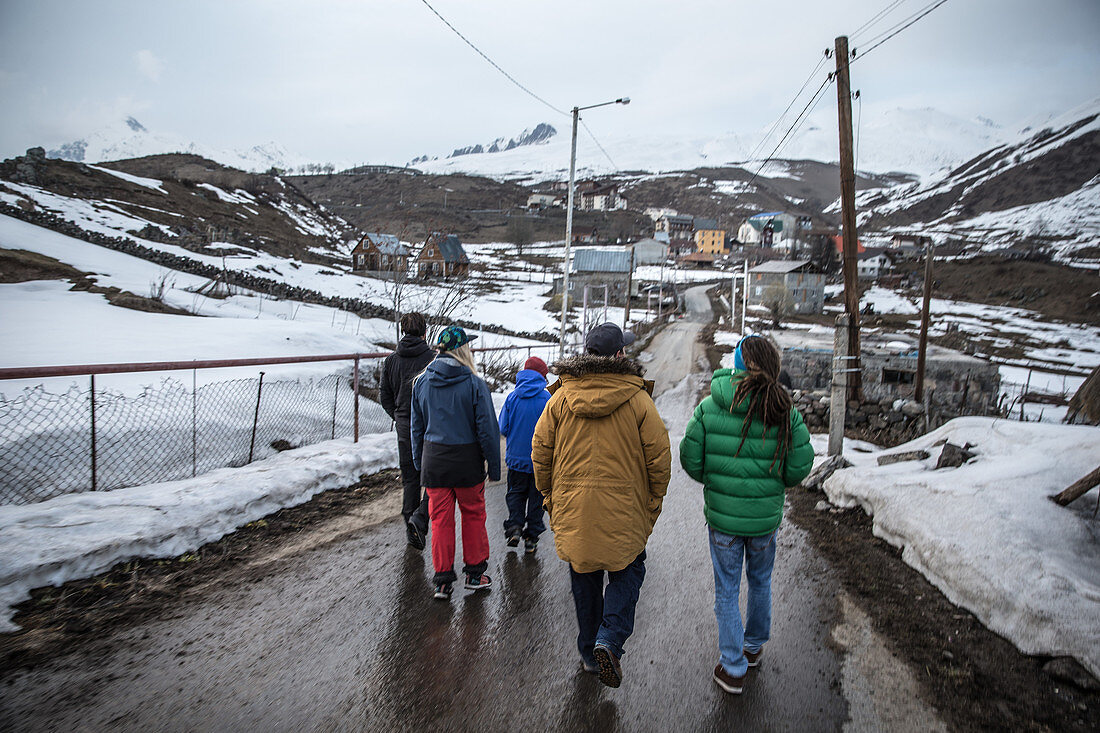 Five young people walking along a street, Gudauri, Mtskheta-Mtianeti, Georgia