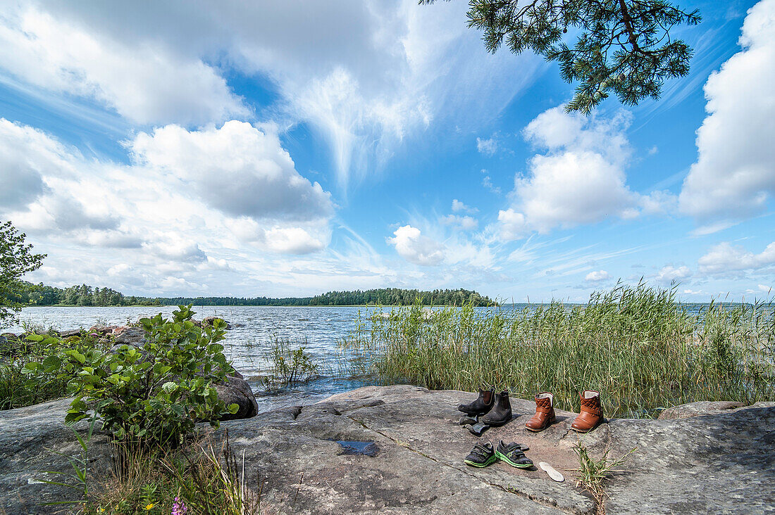 shoes drying on a rock at the shore of lake vanern, Halland, Sweden