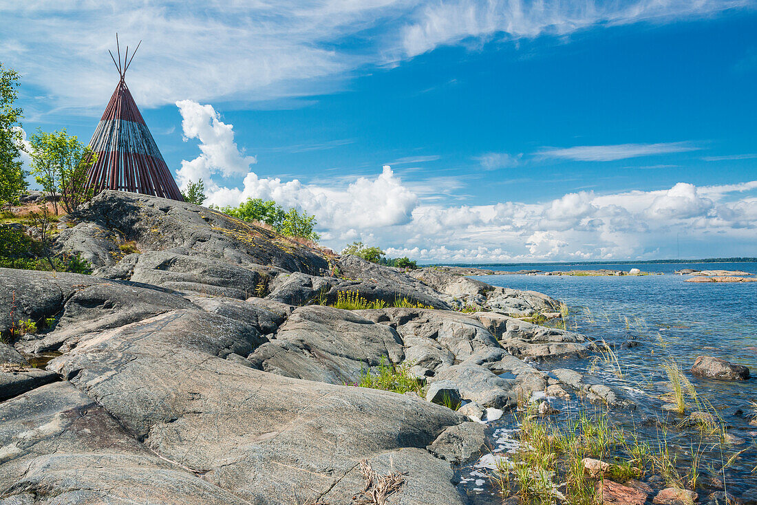 wooden tent standing on the rocks at the waterfront, Oregrund, Uppsala, Sweden