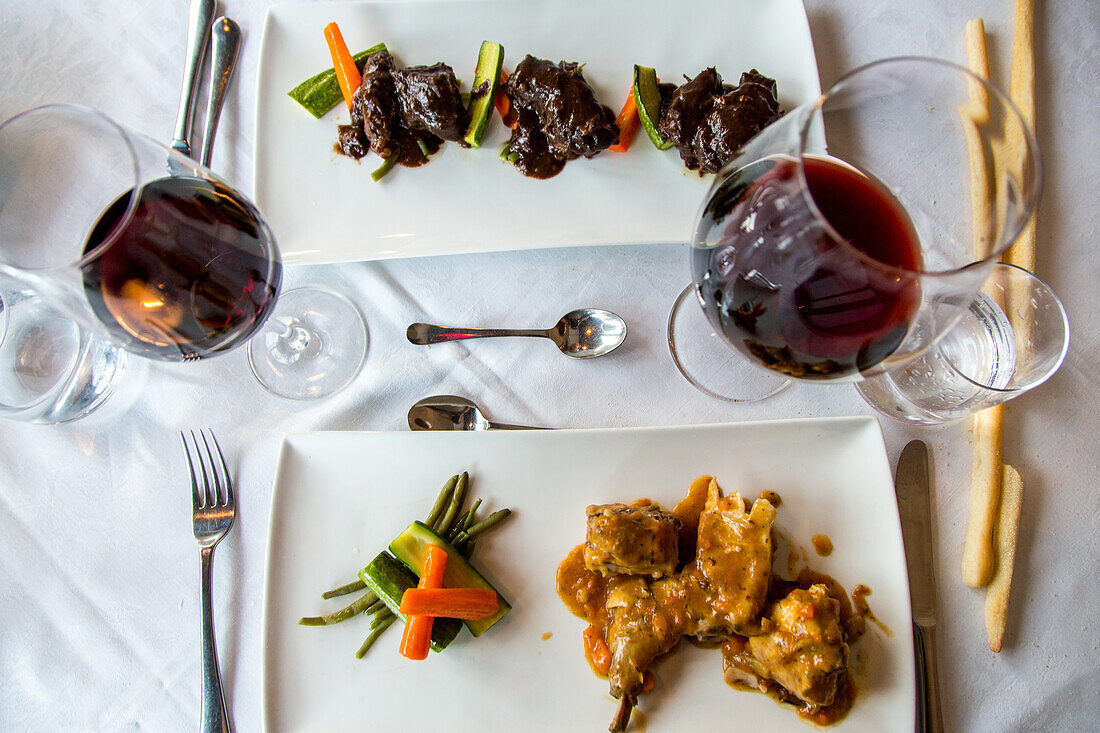 rabbit and beef cheeks, Barolo wine, table setting, restaurant, Piedmont, Italy