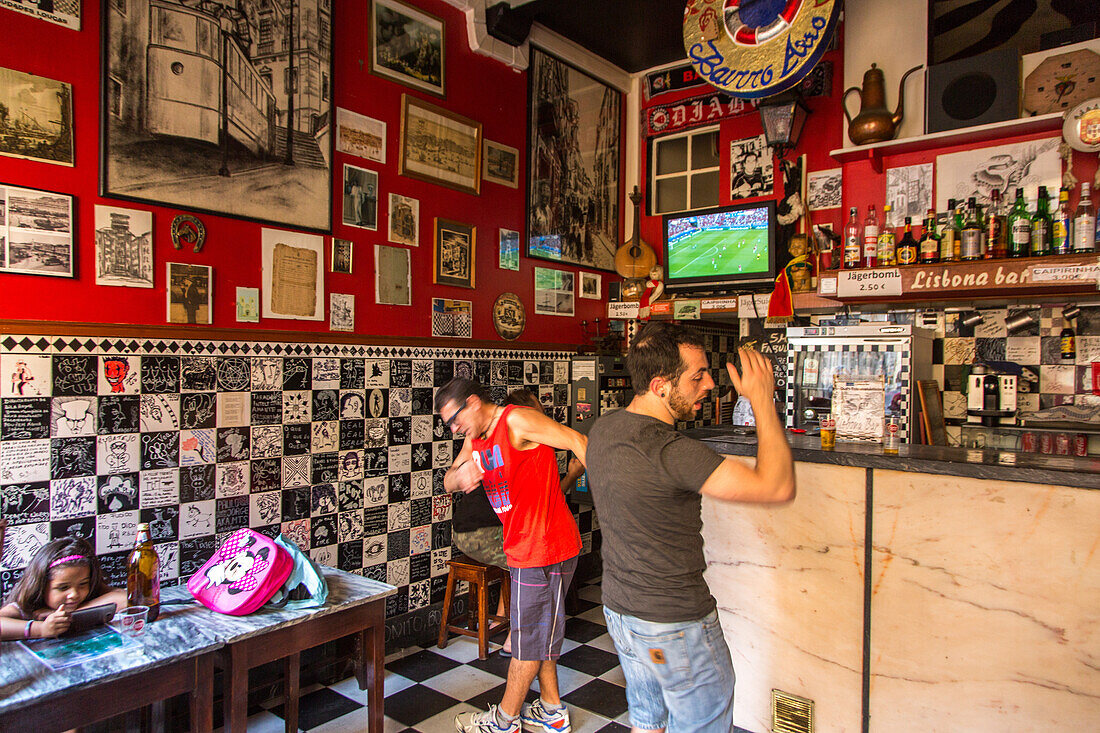 football fans watching European Cup in TV in a bar, Lisbon, Portugal