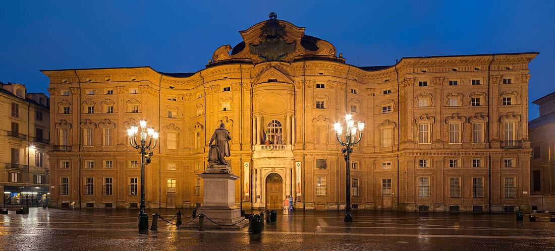 Panorama of the illuminated Palazzo Carignano in the blue of the night, UNESCO World Heritage Site residences of the House of Savoy, Turin, Piedmont, Italy
