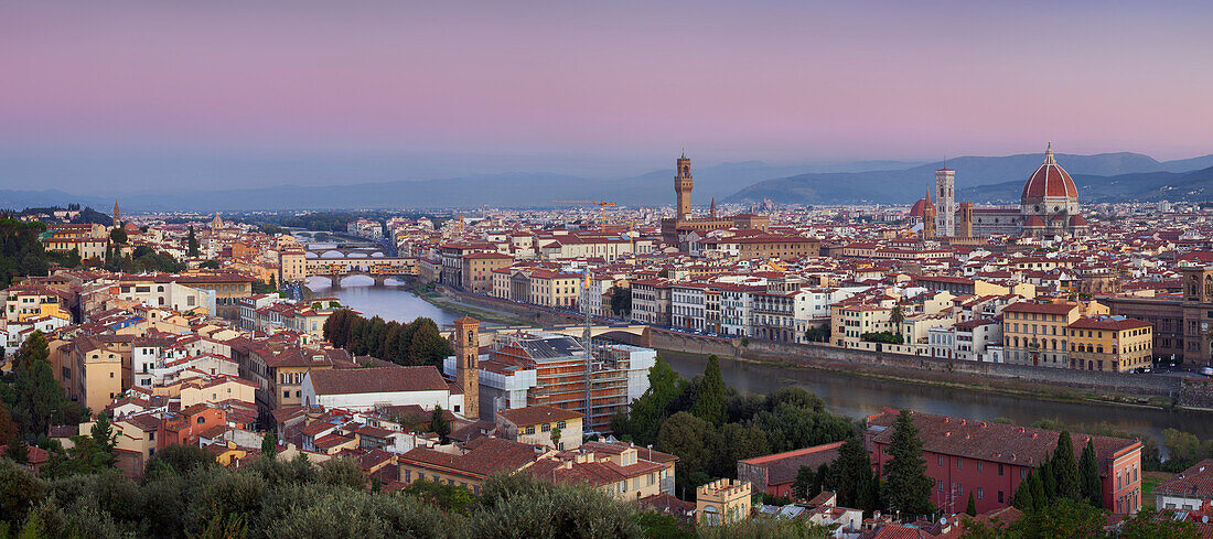 View from Piazzale Michelangelo shows the Arno Valley and Florence with the cathedral Santa Maria del Fiore and the Palazzo Vecchio at dawn, Tuscany, Italy
