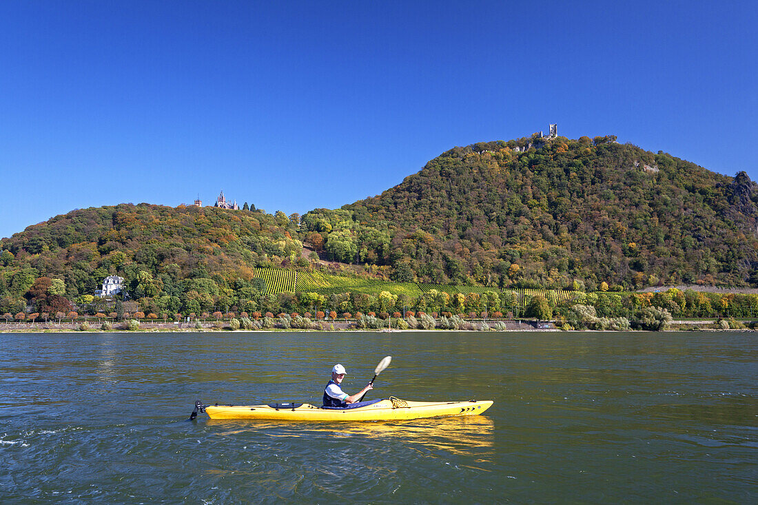 Kayak on the river Rhine in front of castle Drachenburg on the Drachenfels, from Bonn Mehlem, Middle Rhine Valley, North Rhine-Westphalia, Germany, Europe